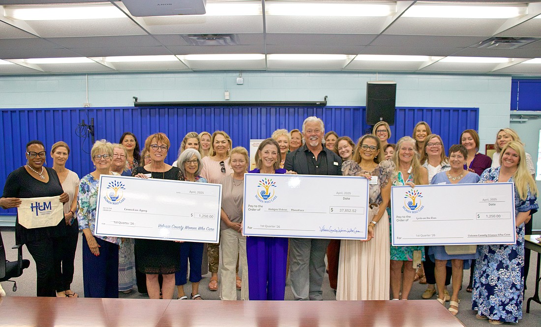 VCWWC members present a $37,852.52 grant to Halifax Urban Ministries during a
check presentation at Hope Place in Daytona Beach. In addition, checks from the CPIF of $1,250 each. Courtesy photo
