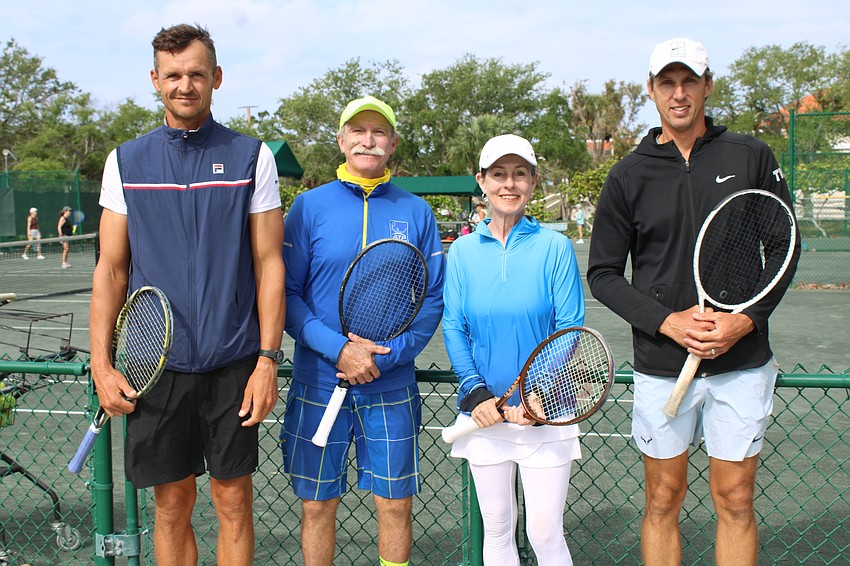 Longboat Key Tennis Center pros Tomasz Borucki, Robbie Salum and Robert Jendelund join manager Kay Thayer for a windy day on the courts for end-of-season clinics.
