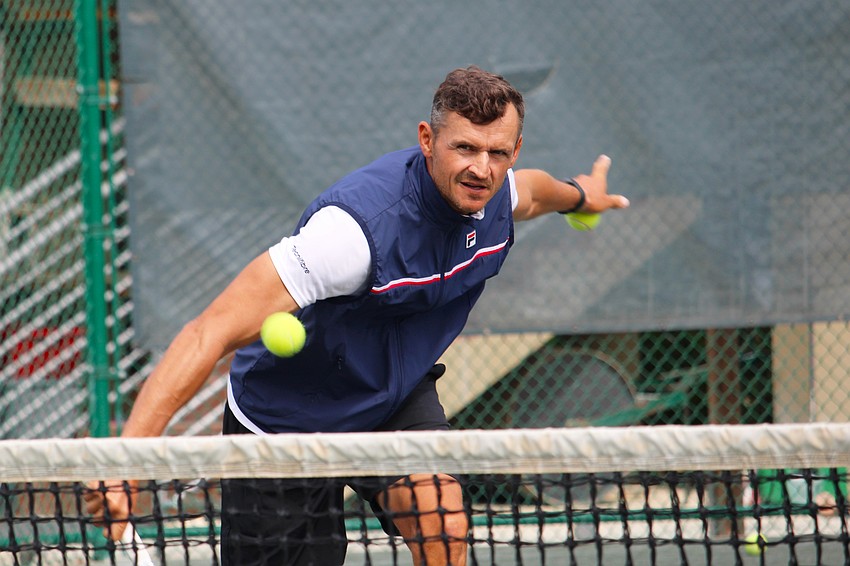 Tomasz Borucki, an instructor at the Longboat Key Tennis Center, plays doubles during an April 8 clinic.