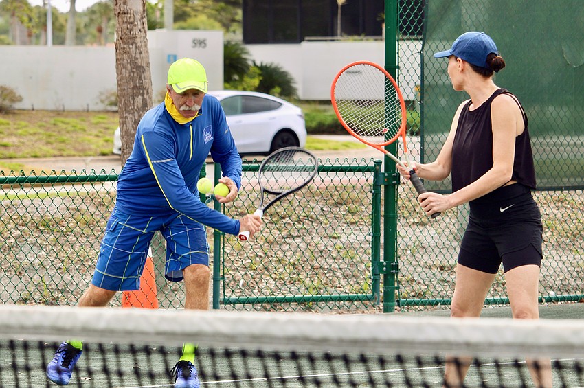 Longboat Key Tennis Center pro Robbie Salum instructs Erica Kelso at an April 8 clinic.