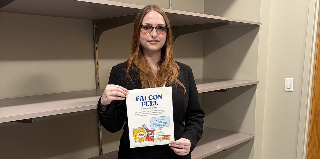 Sofya Reshetnikova, a sophomore at Daytona State College, shows off the Falcon Fuel pantry. Courtesy photo