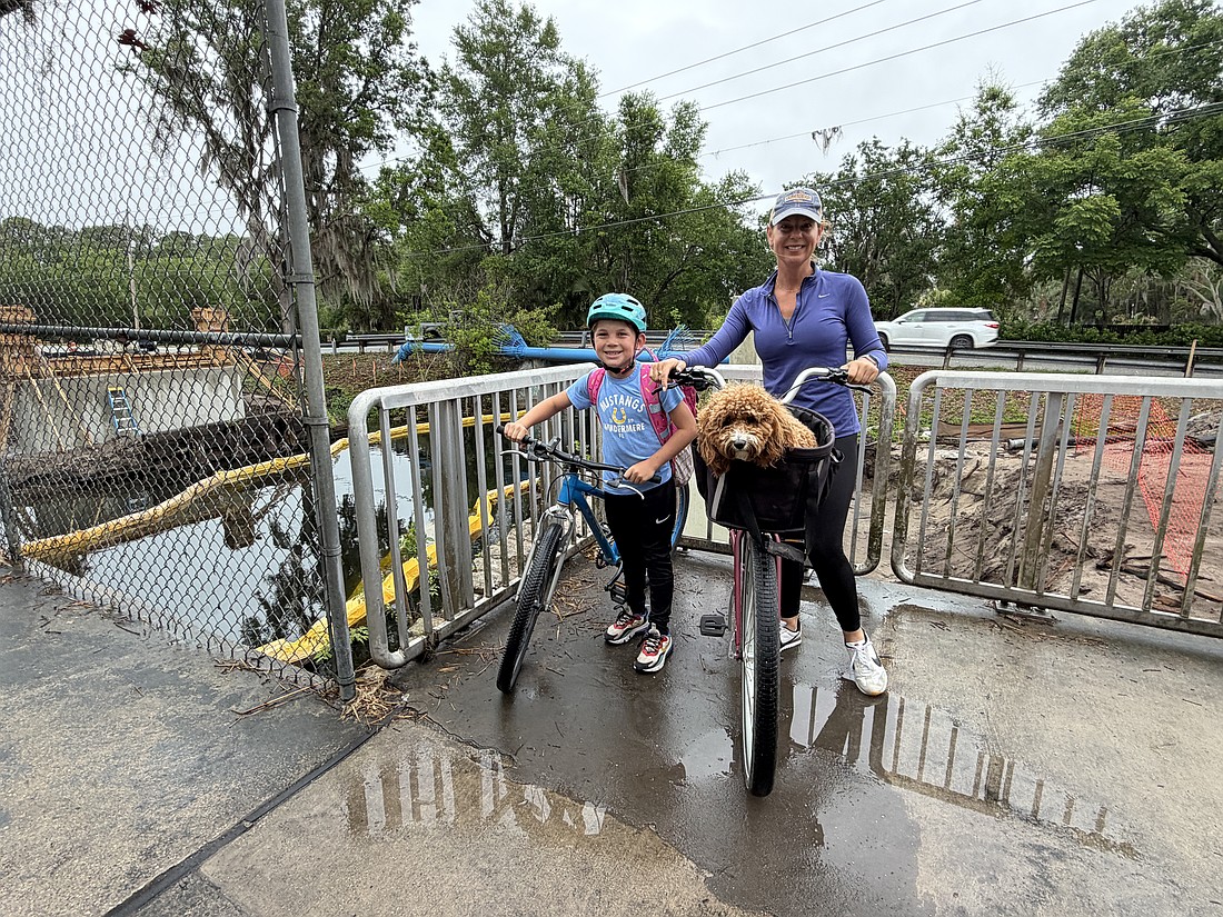 Emmett Thon, a Windermere Elementary School fourth-grader, and his mom, Leah Thon, ride their bikes over the pedestrian bridge every day. They can’t wait for the Ward Trail to be complete as it will provide a safer way to get to school.
