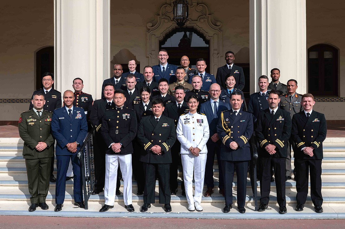 Lt. Barret Manfre (front row, right) has graduated from the Naval Post Graduate School in Monterey, California. Courtesy photo