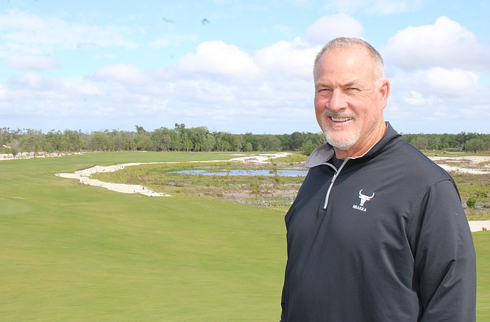 Steve Herrig, the owner of the Miakka Golf Club, which is expected to open in November, stands in front of a fairway and one of the many wetland areas formed by his course's construction.