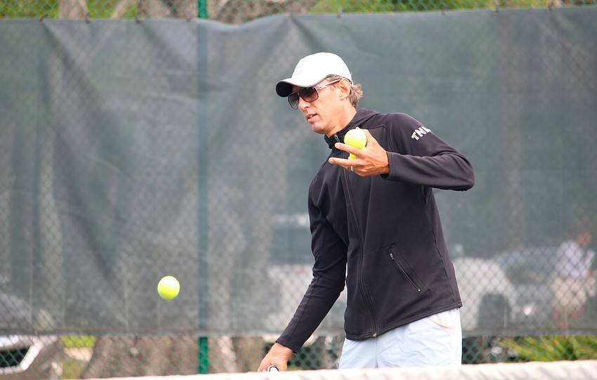 Instructor Robert Jendelund returns a quick-sinking serve on the Longboat Key Tennis Center courts.