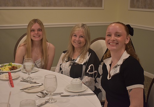 Chloe Jarvis, Vice President Donna Quilici-Smith and Sara Sweetnich socialize before the scholarships are given out at Palm Aire Country Club April 10.