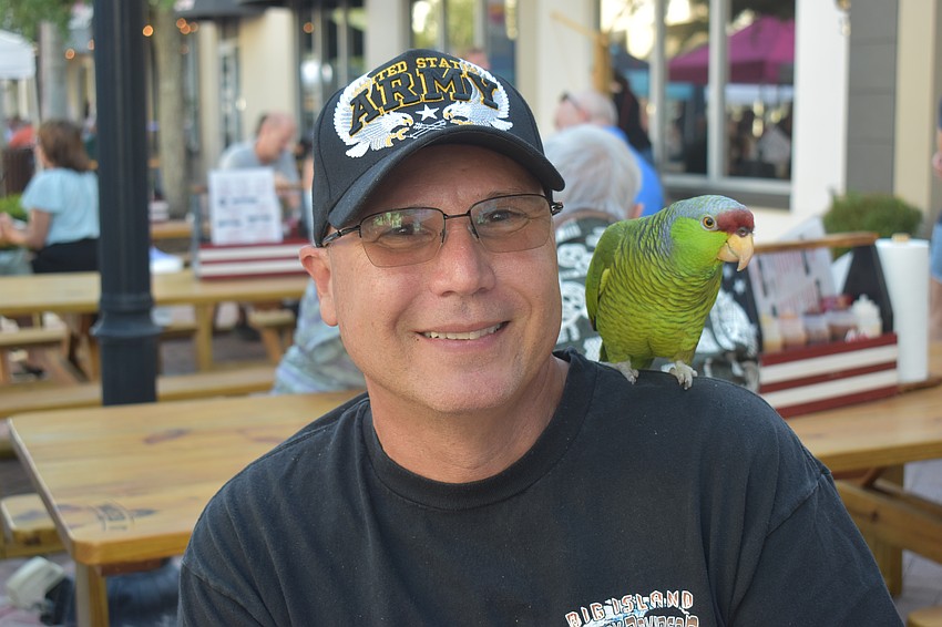 Parrish’s Lyle Pohlen, along with his Lilac-crowned amazon named Taco, attend the Lakewood Ranch Block Party April 10.