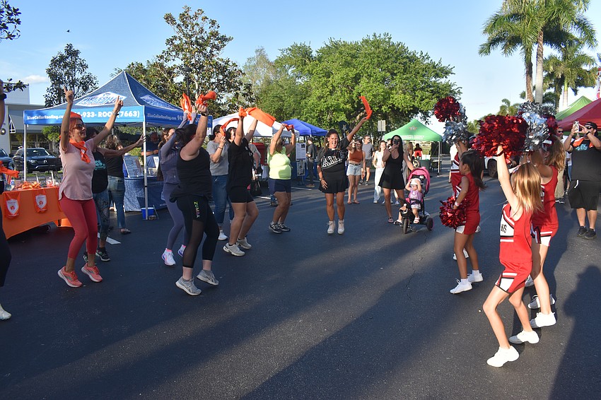 SunCourt Sports ZRockstars, led by Yael Campbell, dance with the Lakewood Ranch Titans at the Lakewood Ranch Block Party.