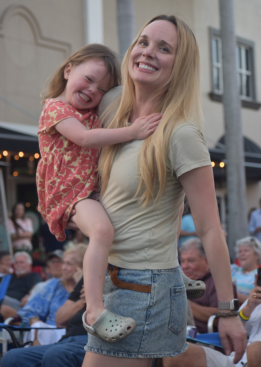 Sarasota's Parker Doak, 4, and her mom Jenny dance together to music performed by Jesse Daniels Band. Jenny says it is a magical experience to do so together.
