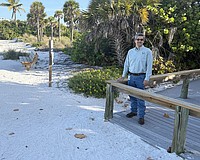 Sarasota City Engineer Sage Kamiya at the Lido Beach Pavilion walkover, which will be replaced when 6-foot-high dunes are built in the area.