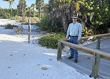 Sarasota City Engineer Sage Kamiya at the Lido Beach Pavilion walkover, which will be replaced when 6-foot-high dunes are built in the area.