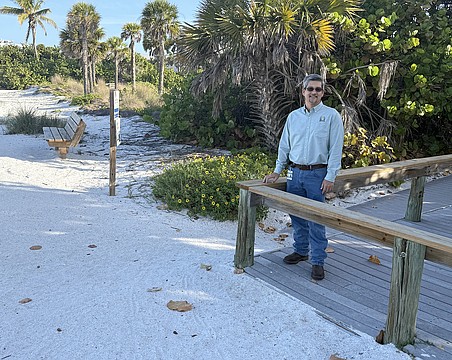 Sarasota City Engineer Sage Kamiya at the Lido Beach Pavilion walkover, which will be replaced when 6-foot-high dunes are built in the area.