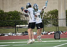 Junior Jackson Zackery (left) celebrates with senior Peyton Hens (right) after a goal against Sarasota High on April 9 in the FHSAA Class 2A-District 12 quarterfinals. Lakewood Ranch advanced with a 13-4 victory.