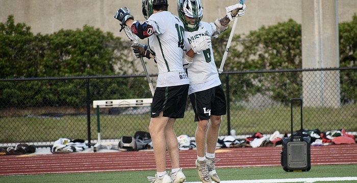 Junior Jackson Zackery (left) celebrates with senior Peyton Hens (right) after a goal against Sarasota High on April 9 in the FHSAA Class 2A-District 12 quarterfinals. Lakewood Ranch advanced with a 13-4 victory.