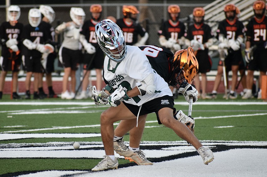 Junior Sawyer Johnson (front) duels with Charlie Rasool (back) in a faceoff. Johnson handled 87.2% of the Mustangs' faceoffs through their first 12 games, posting a .630 winning percentage.