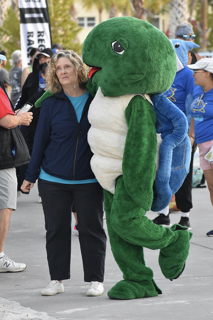 Laurie Riehm serves as Shelley's stretching buddy.