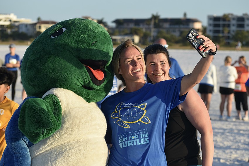 Elizabeth Wiegner and Sarah Degroot take a picture with Shelley.