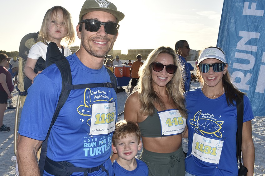 Avery Frye, 2, her father Sean Frye, brother Aiden Frye, 5, aunt Kyla Cuomo and mother Kyra Frye prepare for the race.