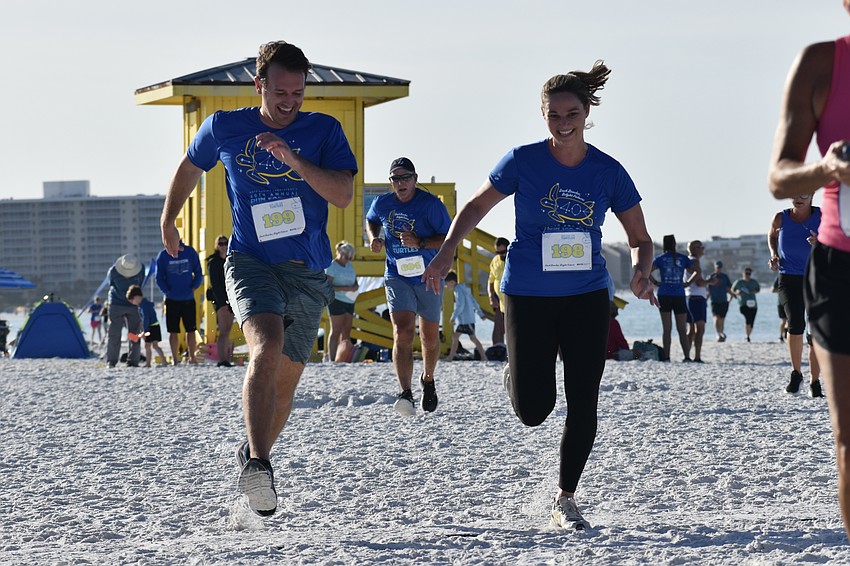 Steven Yarbrough, Leonard McAlister and Delaney Mahon, approch the finish line.