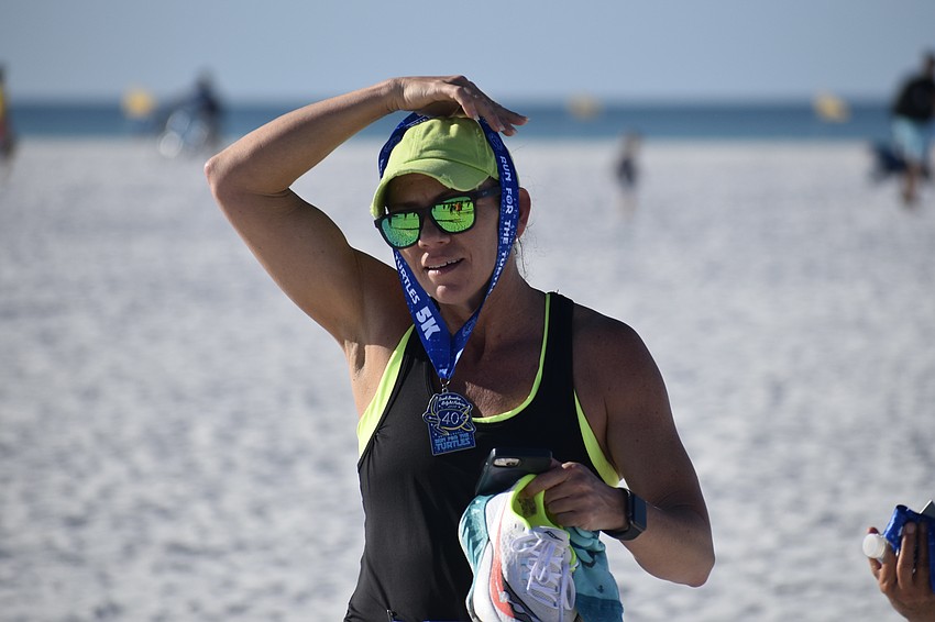 Meggan Patten accepts a medal.