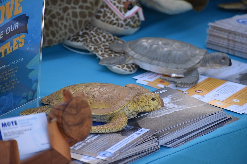 A table at the event offers information.