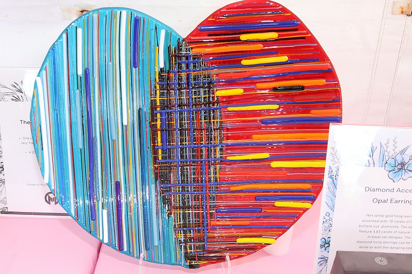 Silent auction items include donated artwork.