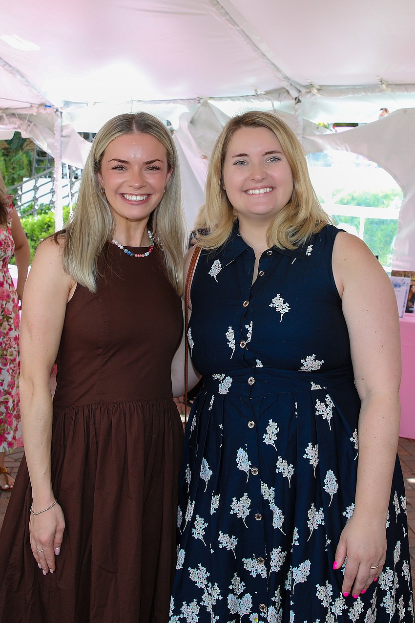 Katie Gallagher and Erica Neal enjoy the sip and shop held before lunch.