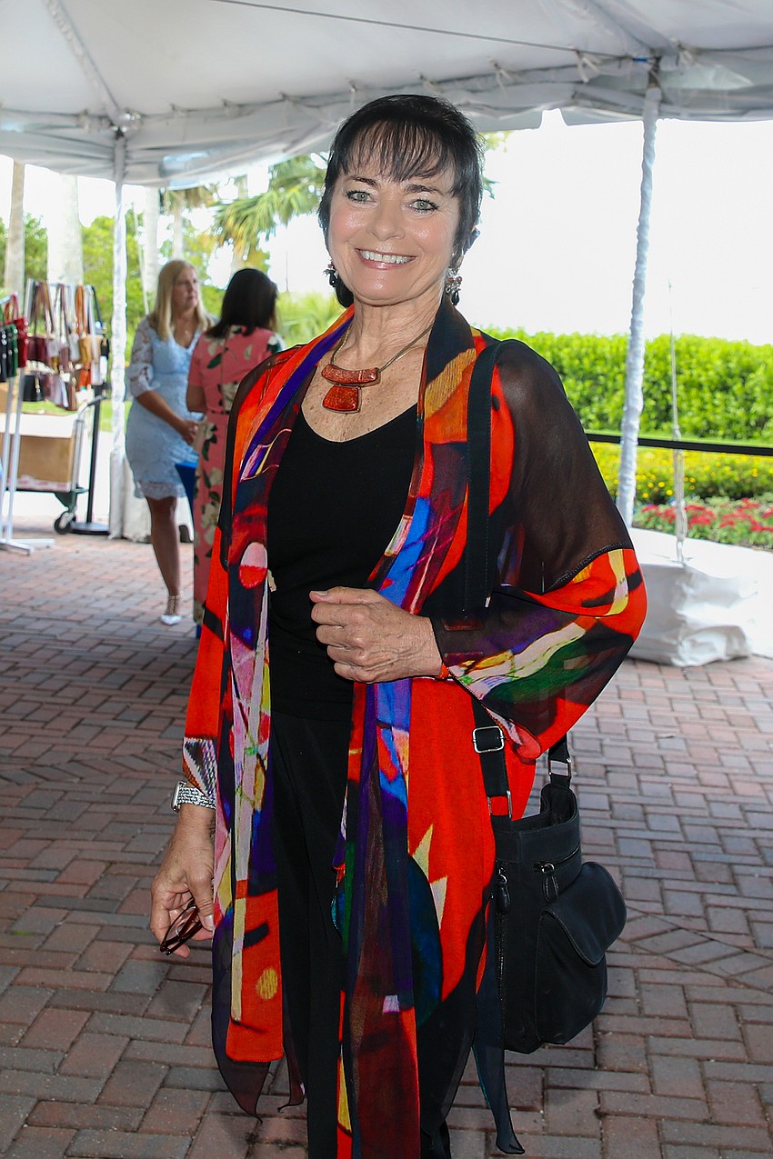 Sarasota's own award-winning aerialist Dolly Jacobs is stunning in her bold Alexander Calder-inspired colors.