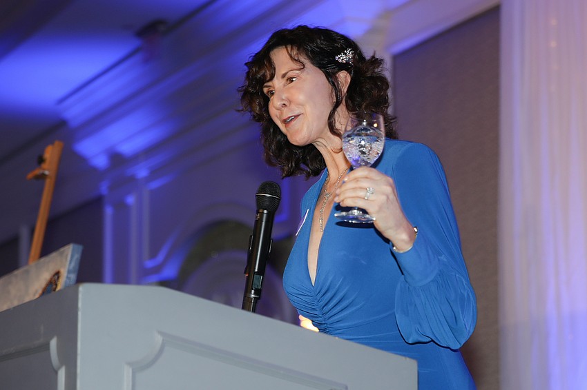 Board Chair Jen Douglas gives remarks.