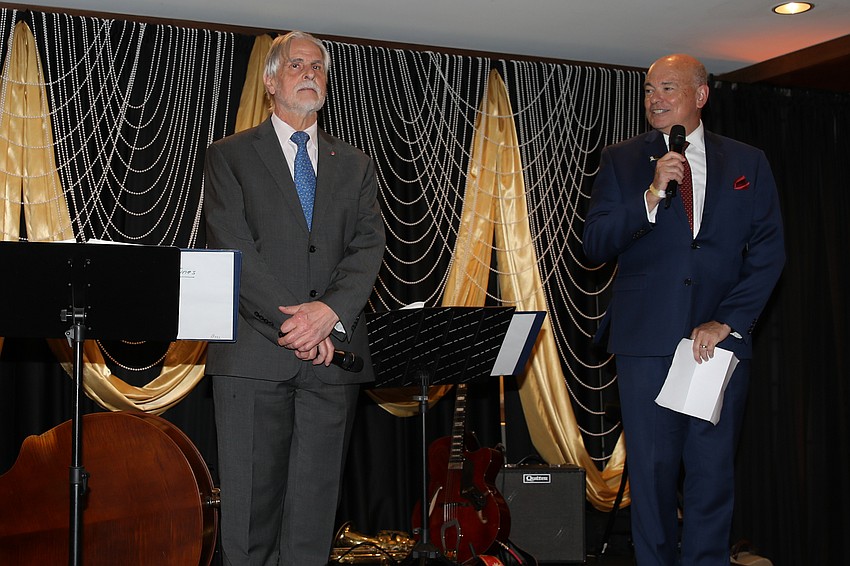 The Sarasota Opera's artistic director Victor DeRenzi and general director Richard Russell give remarks during dinner.