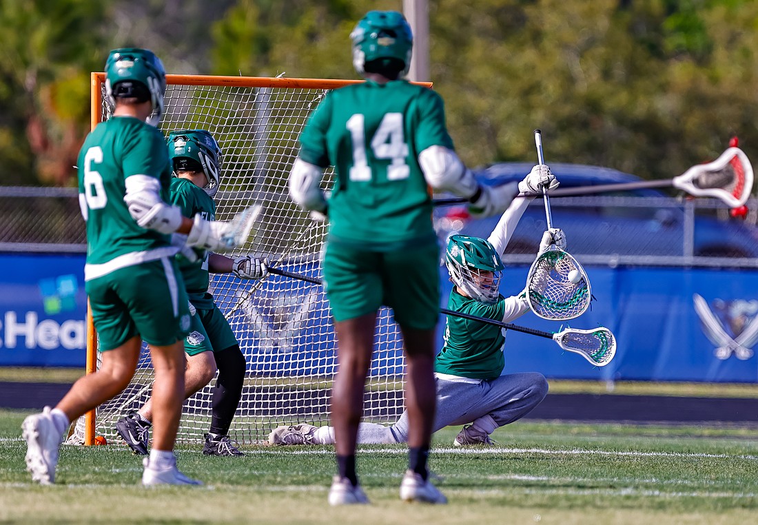 FPC goalie Aiden Commendatore makes a spectacular save in a high school lacrosse game earlier this spring. Photo by Keishia McLendon