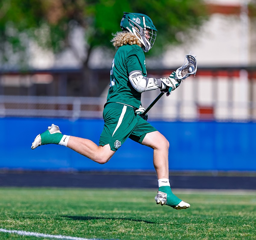 FPC midfielder Brayden Norton-Henry gallops with the ball in a lacrosse game against Matanzas this past season. Photo by Keishia McLendon FPC midfielder Brayden Norton-Henry gallops with the ball in a lacrosse game against Matanzas this past season. Photo by Keishia McLendon