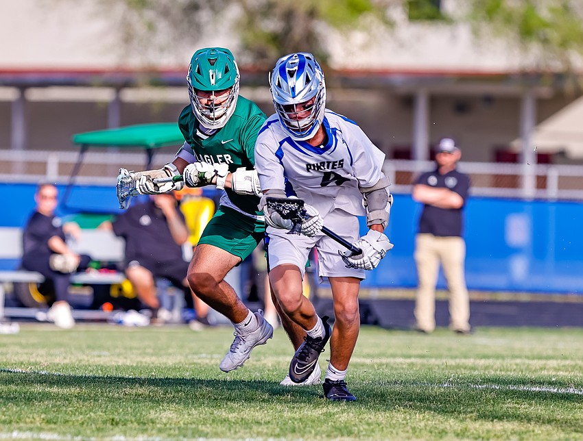 Matanzas' CJ Schouten (right) comes up with the ball after a faceoff with FPC's Zane Dailey in a lacrosse game this past season. Photo by Keishia McLendon Matanzas' CJ Schouten (right) comes up with the ball after a faceoff with FPC's Zane Dailey in a lacrosse game this past season. Photo by Keishia McLendon