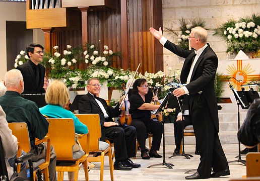 Conductor Glen Olsen introduces trumpet soloist Ricardo Chinchilla, who accompanied members of the Sarasota Bay Chamber Orchestra on April 10 for an end-of-season performance at St. Armands Key Lutheran Church.