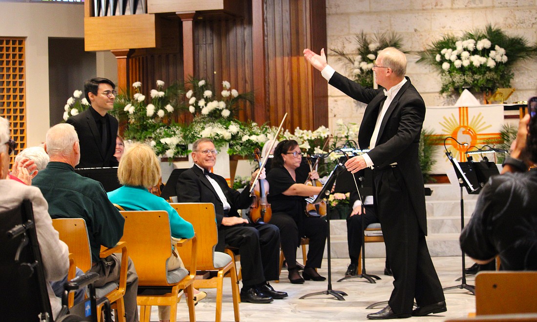 Conductor Glen Olsen introduces trumpet soloist Ricardo Chinchilla, who accompanied members of the Sarasota Bay Chamber Orchestra on April 10 for an end-of-season performance at St. Armands Key Lutheran Church.