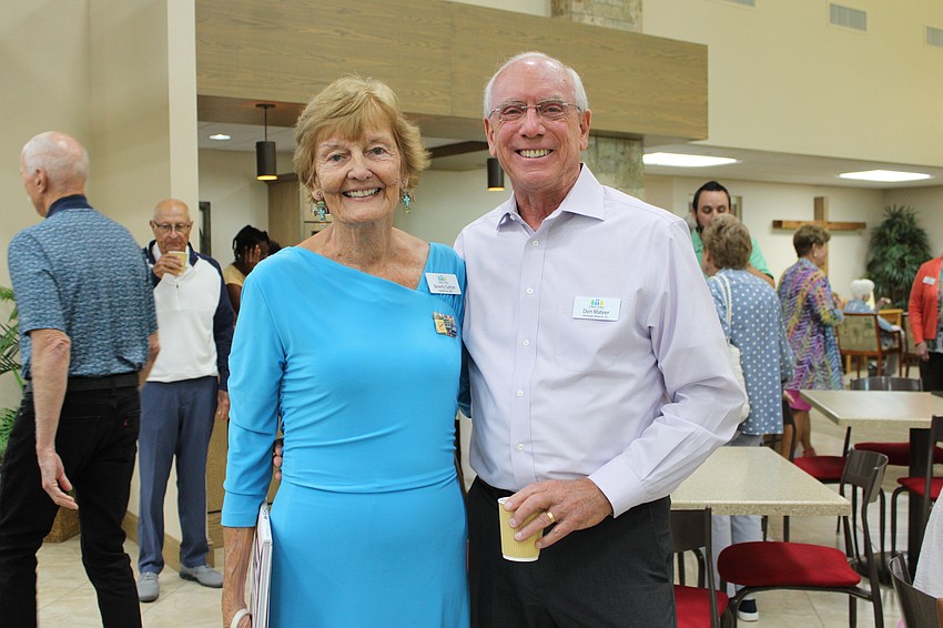 Reading Buddies volunteers Beverly Sutton and Don Mateer connect and reminisce at the April 12 service recognizing teachers and supporters with the program.