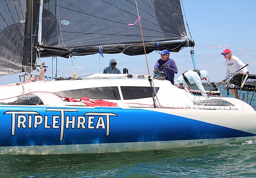 The team aboard the "Triple Threat," captained by John Novak, rounds the first marker of the Bird Key Yacht Club's annual Sarasota Bay Cup regatta on April 11.