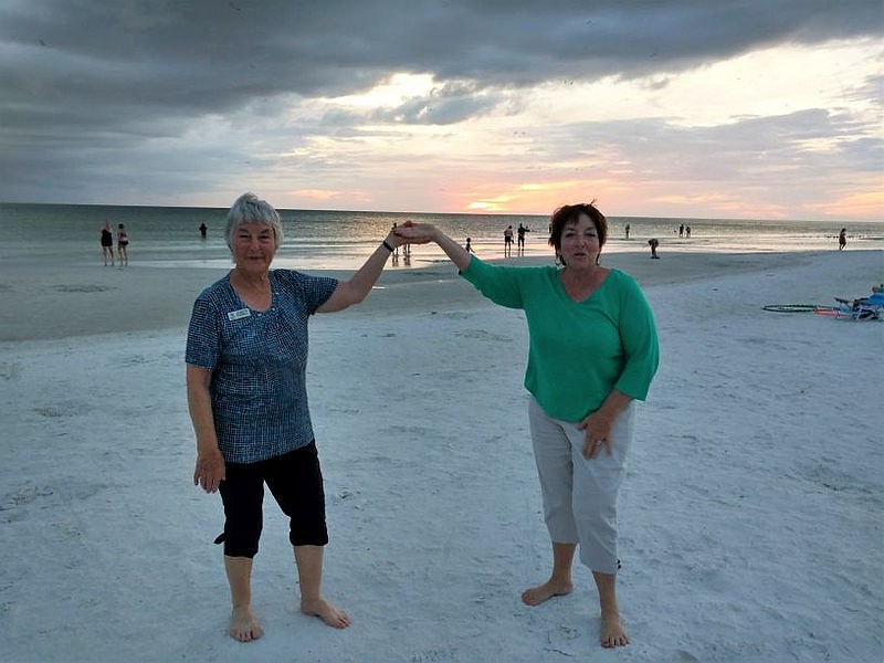Terri Holinger stands with Jeanette Boswell, a member of the Hamilton Waikato Friendship Force club in New Zealand, on Siesta Key Beach in 2017.