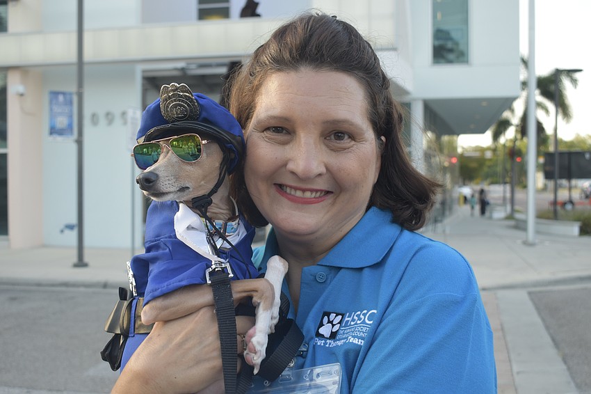 Marsha Stanisic of the Humane Society of Sarasota County's Pet Therapy Team brought along Dolly, who came dressed like one of the team.