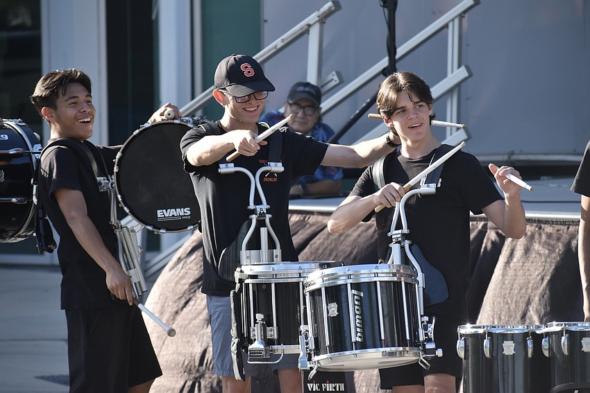 Seniors Oscar Ramirez and Bodhi Kirschner, and sophomore Dylan Bird, of Sarasota High School, perform in the drum line.