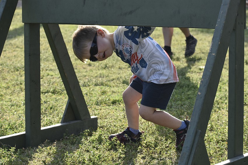 Jack Nichols, 3, ducks during the obstacle course.