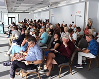 Facilitator David Brain presents findings of the first St. Armands visioning session to the audience.