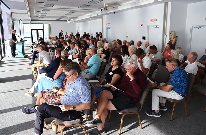 Facilitator David Brain presents findings of the first St. Armands visioning session to the audience.