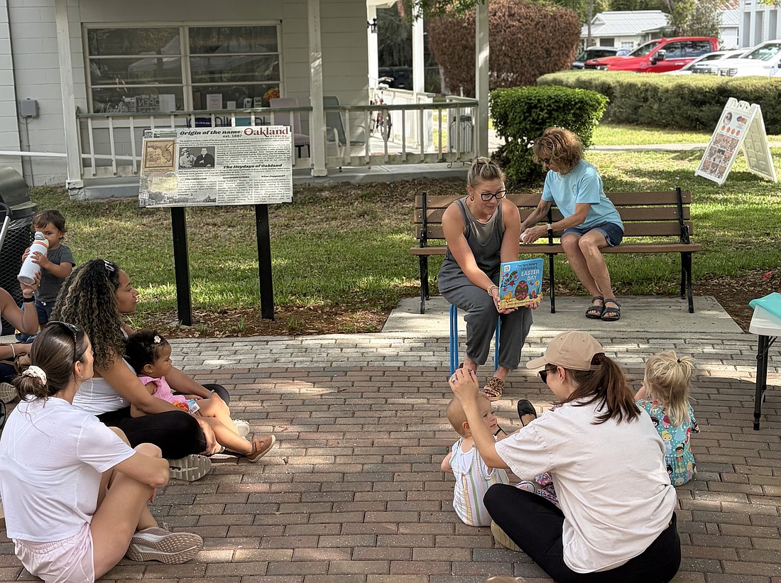 Tabitha Erbe finds joy in reading for children at Oakland's farmers markets.
