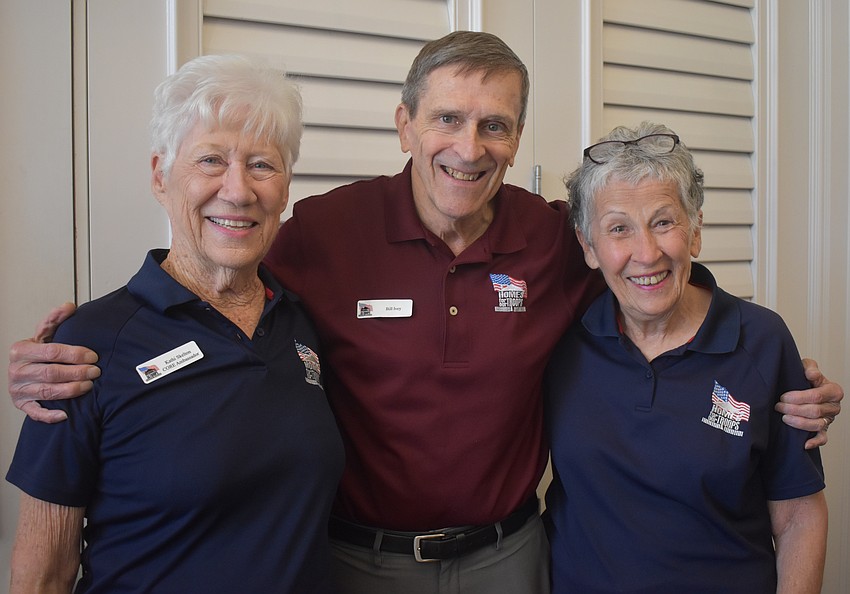 The Rosedale Golf Classic founders Kathi Skelton and Deb Kehoe join Bill Ivey, the executive director of Homes for Our Troops, for a photo prior to the opening ceremony.