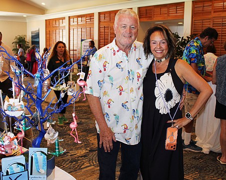 Le Gardenia Bleu's John and Lita Brannan showcase their ornament tree filled with Florida's iconic flamingos and more at the 20th annual Meet Greet Eat.