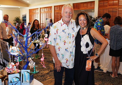 Le Gardenia Bleu's John and Lita Brannan showcase their ornament tree filled with Florida's iconic flamingos and more at the 20th annual Meet Greet Eat.