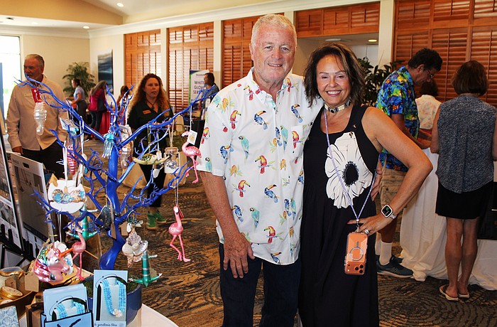 Le Gardenia Bleu's John and Lita Brannan showcase their ornament tree filled with Florida's iconic flamingos and more at the 20th annual Meet Greet Eat.