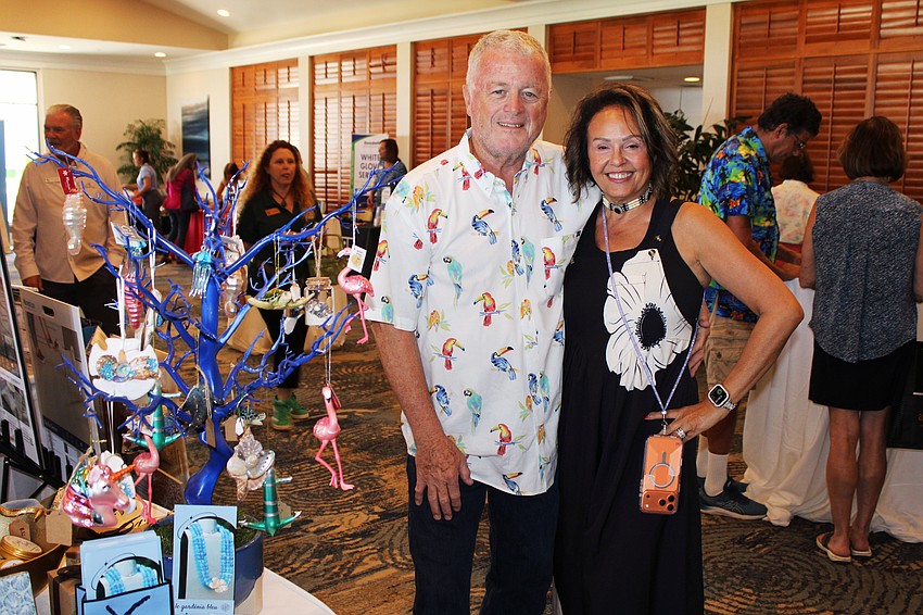 Le Gardenia Bleu's John and Lita Brannan showcase their ornament tree filled with Florida's iconic flamingos and more at the 20th annual Meet Greet Eat.