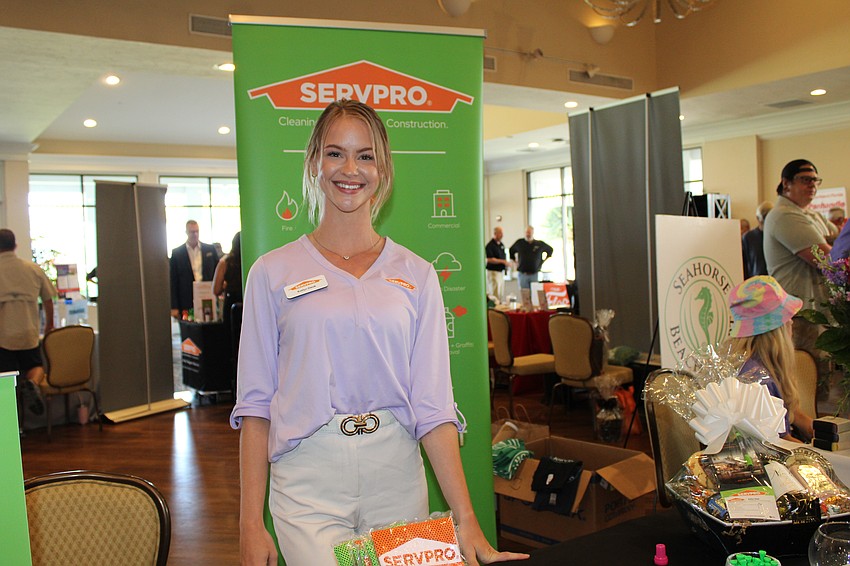 Servpro's Katlyn Deak meets and greets visitors at Meet Greet Eat, hosted by the Longboat Key Chamber of Commerce.